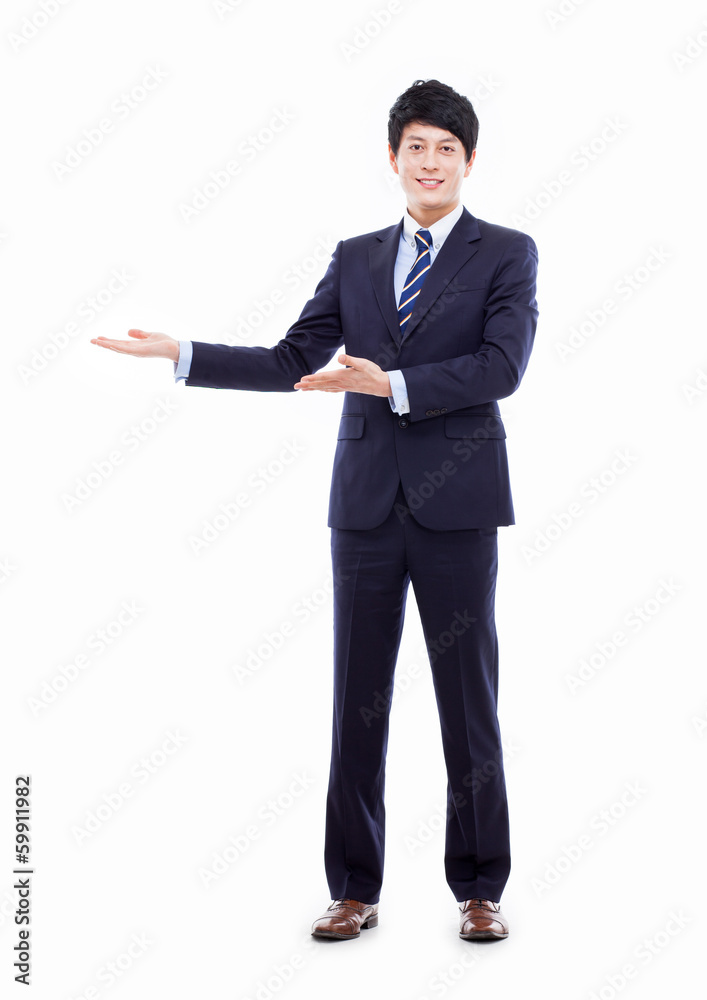 Young Asian business man showing something Young Asian business man showing something