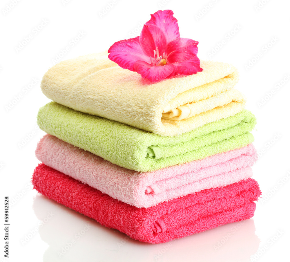 bright towels and flower isolated on white bright towels and flower isolated on white