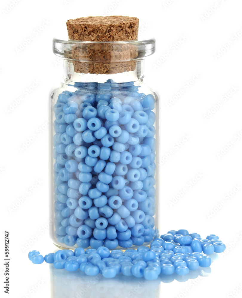 Little bottle full with colorful beads isolated on white Little bottle full with colorful beads isolated on white