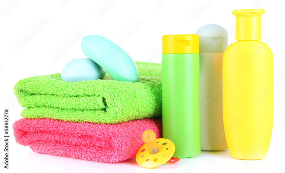 Baby cosmetics, soap and towels, isolated on white Baby cosmetics, soap and towels, isolated on white