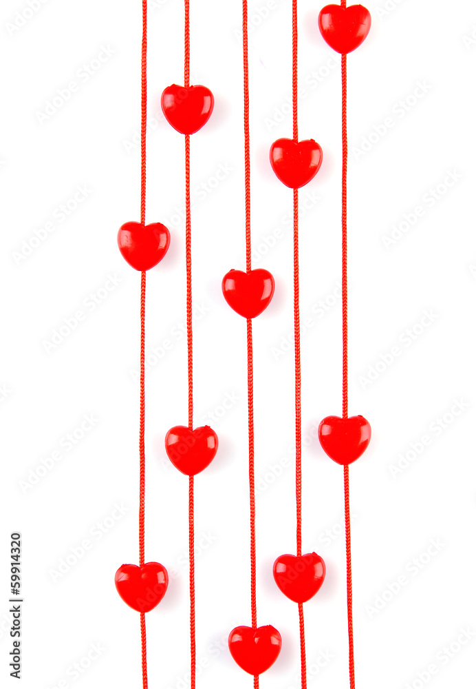 Heart-shaped beads on string isolated on white