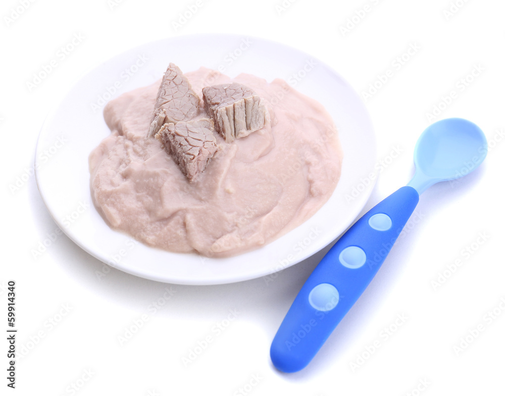 Meat paste for infant feeding, on plate, isolated on white Meat paste for infant feeding, on plate, isolated on white