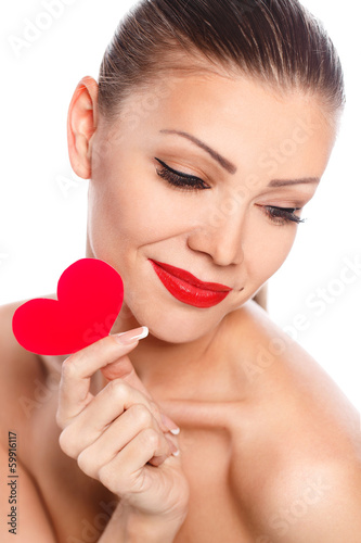 beautiful woman with bright makeup and red heart in hand