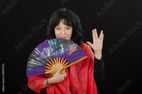 Geisha shows long life and prosperity gesture