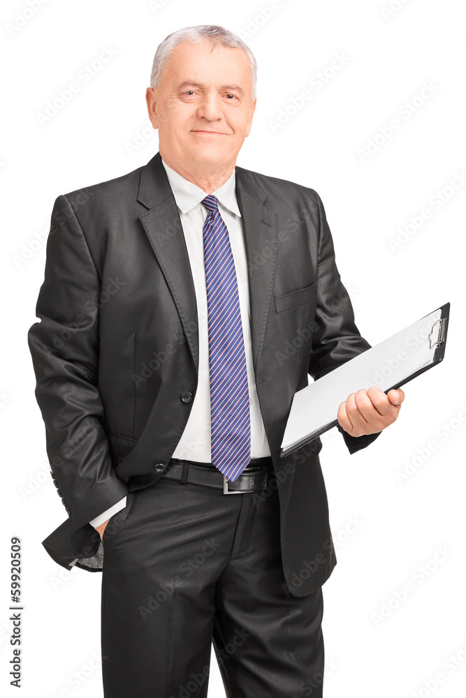 Smiling middle aged businessman holding clipboard Smiling middle aged businessman holding clipboard