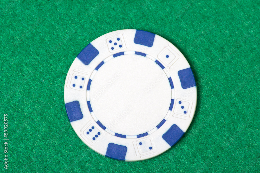 white poker chip on the casino table white poker chip on the casino table