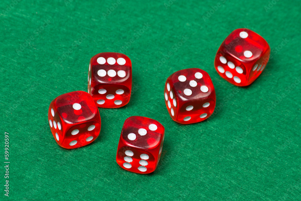 five playing red dices on green table five playing red dices on green table