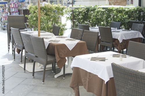 Empty tables of sidewalk cafe