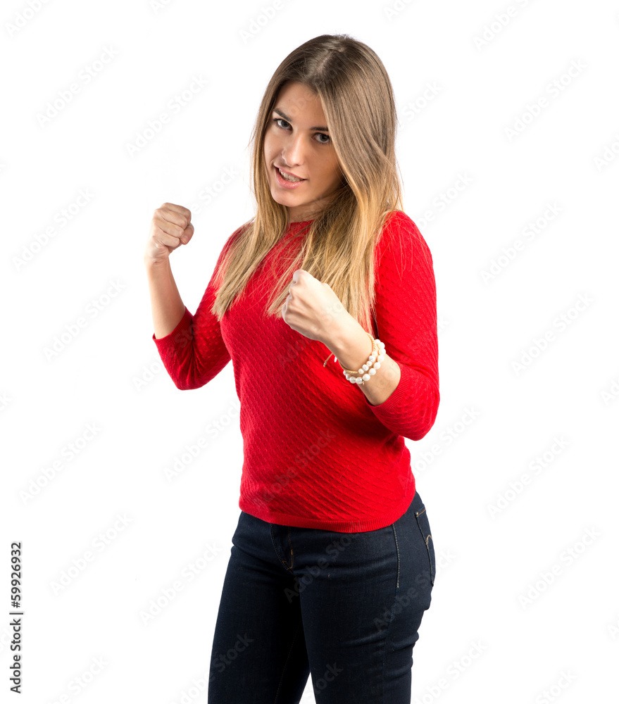 Young girl giving punch over isolated white background Young girl giving punch over isolated white background