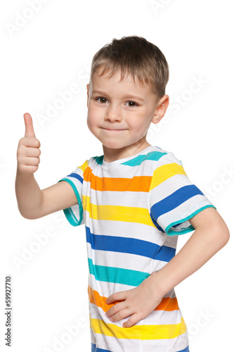 Cute little boy holds his thumb up