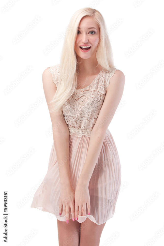 Sexy blonde woman posing with wind in the hair and dress