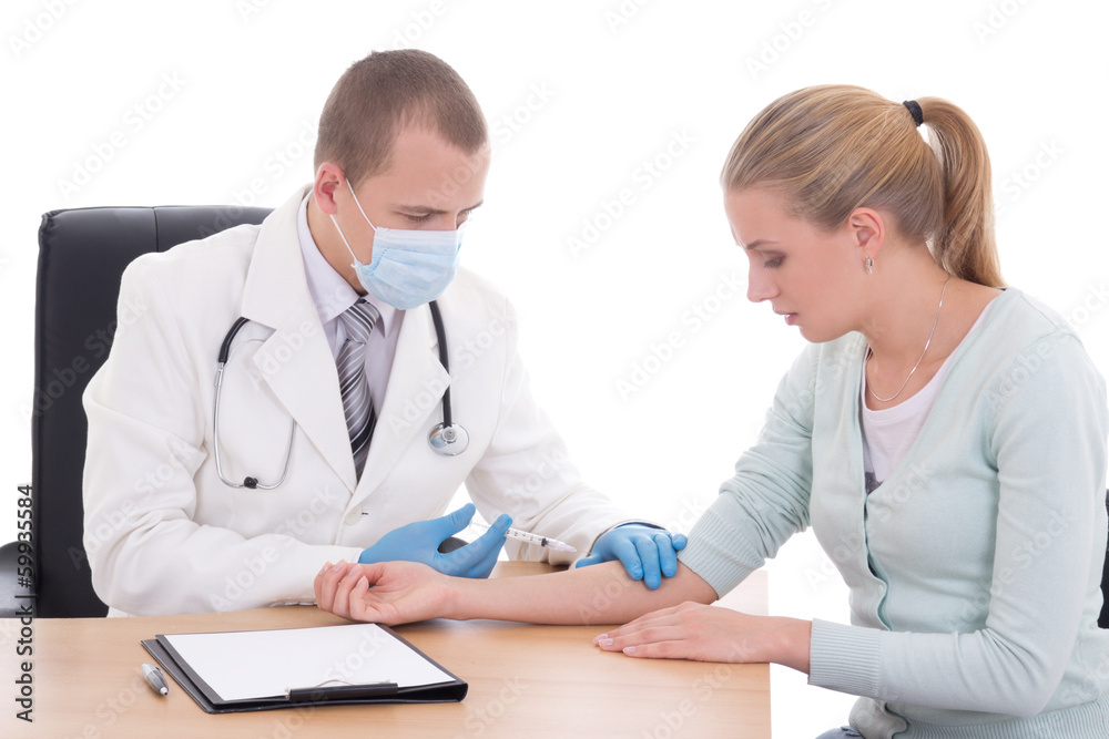 young doctor making the patient an injection isolated on white young doctor making the patient an injection isolated on white