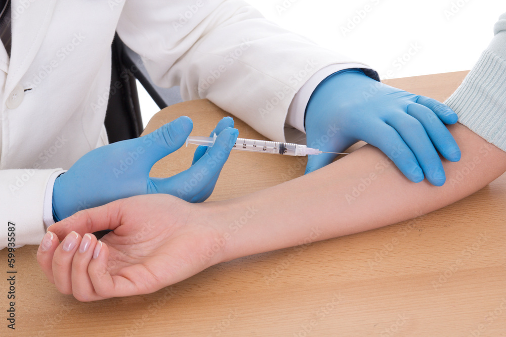 close up of doctor giving an injection to woman close up of doctor giving an injection to woman