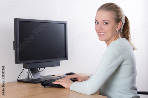Woman using pc with copy space on screen