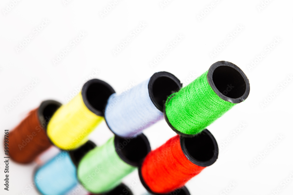 Pyramid of colourful cotton reels Pyramid of colourful cotton reels