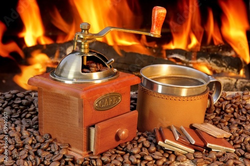 Hot mug of coffee by the fire