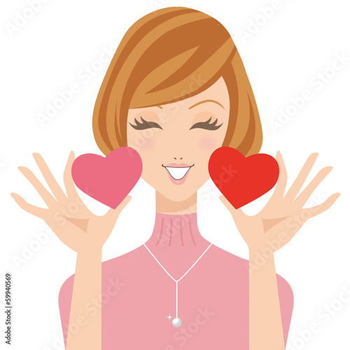 ハートを手に笑顔の女性