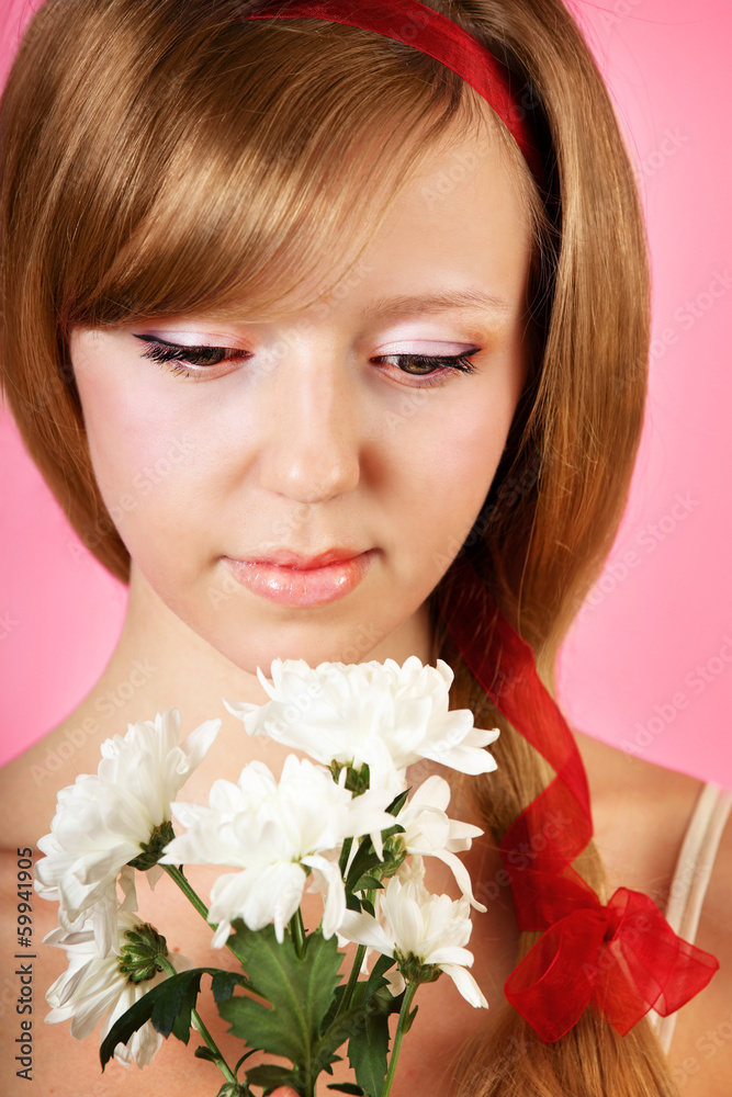Beautiful woman with white flowers on pink background Beautiful woman with white flowers on pink background