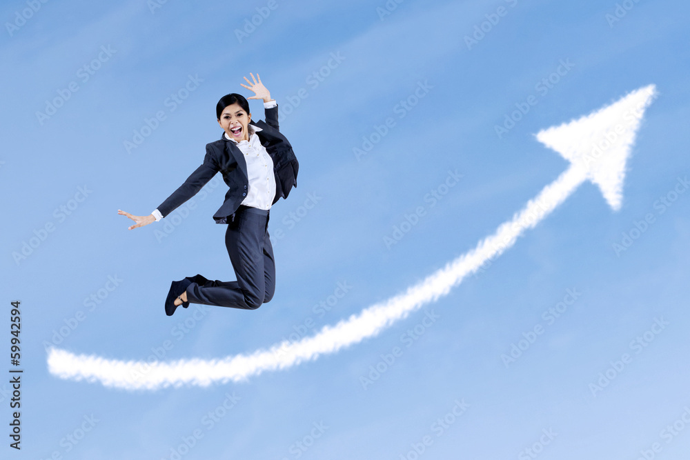 Attractive businesswoman jumping on the sky Attractive businesswoman jumping on the sky