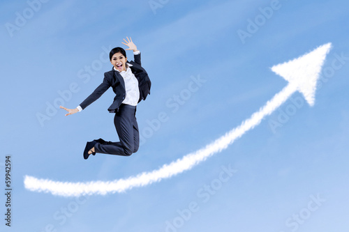 Attractive businesswoman jumping on the sky