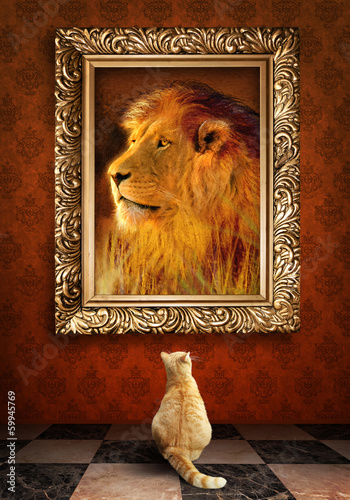 Cat looking at a portrait of a lion in a golden frame.