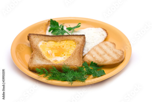 Romantic Breakfast: heart-shaped fried egg, heart-shaped toasts 