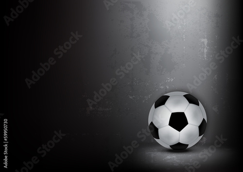 old soccer ball with grunge wall