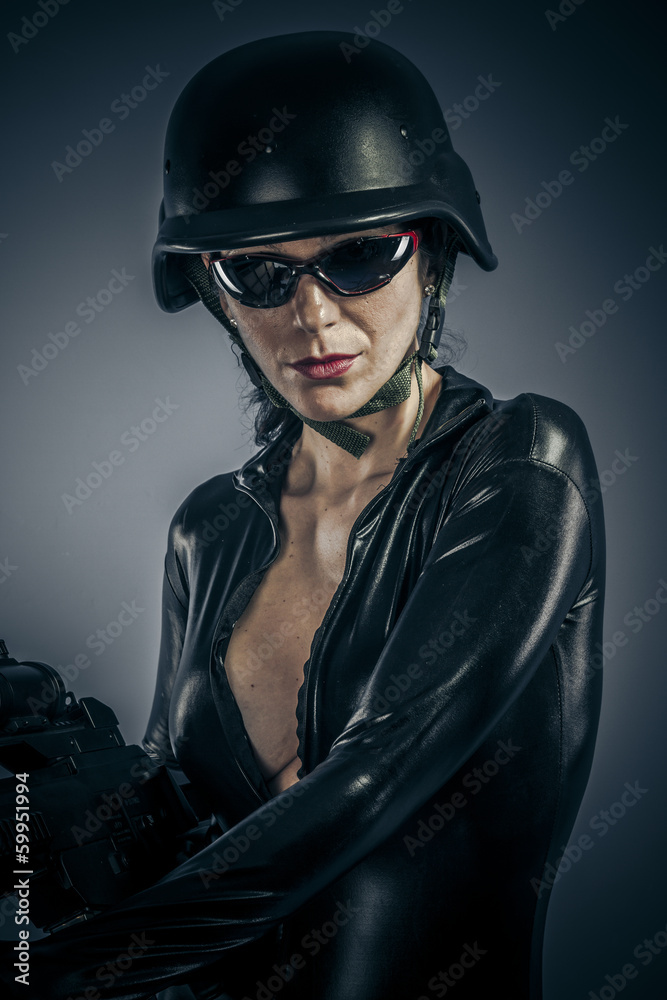American, Sexy girl military woman posing with guns. American, Sexy girl military woman posing with guns.
