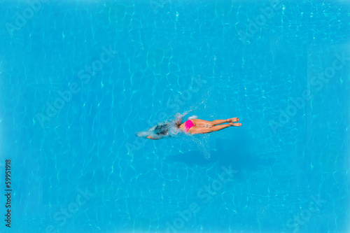 Top view of a girl diving in the pool © Netfalls