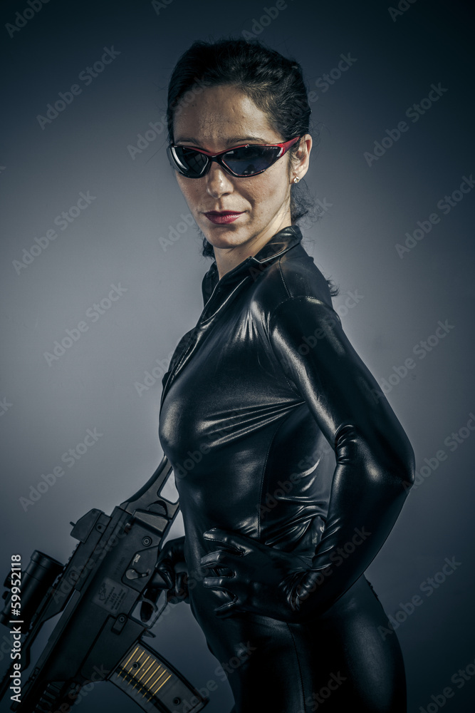 Naklejka premium Machine gun, Sexy girl military woman posing with guns.