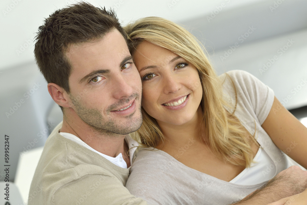 Portrait of young couple relaxing at home Portrait of young couple relaxing at home