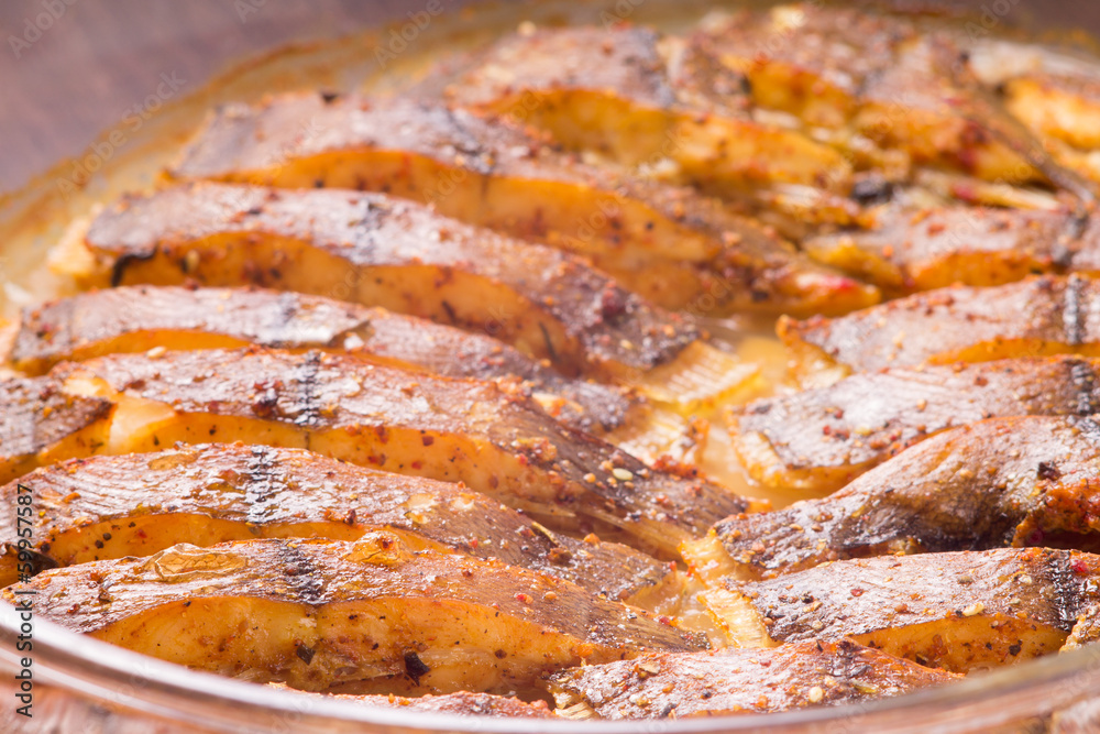Cooked fish with spices baked in oven Cooked fish with spices baked in oven