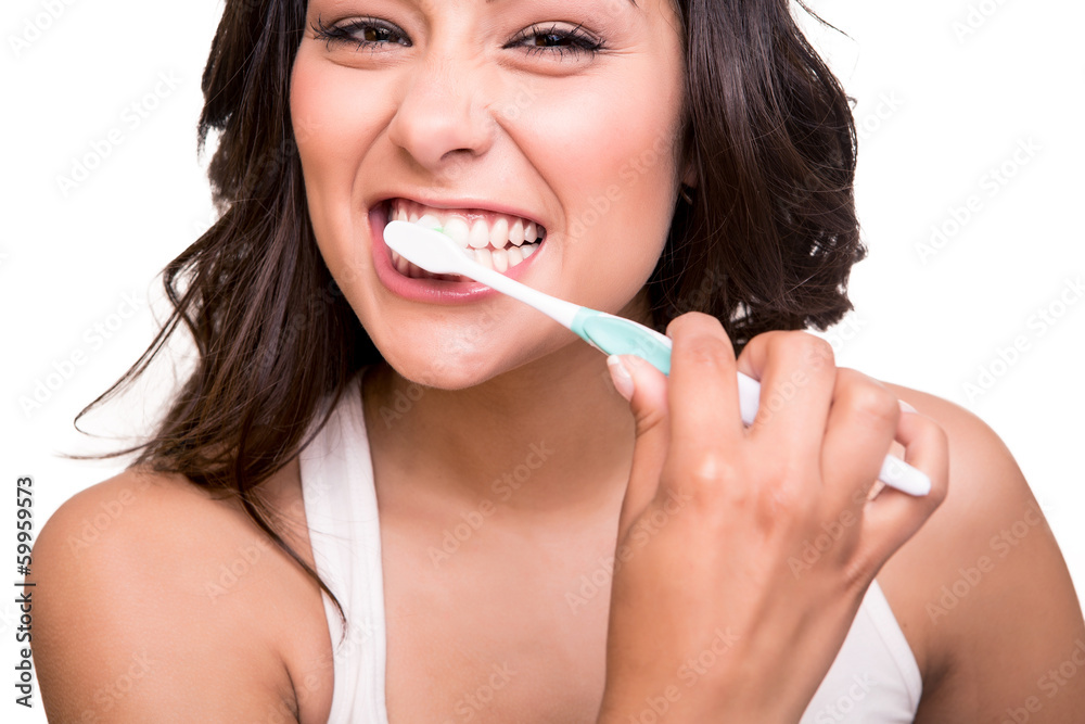 Obraz premium Woman holding a tooth brush