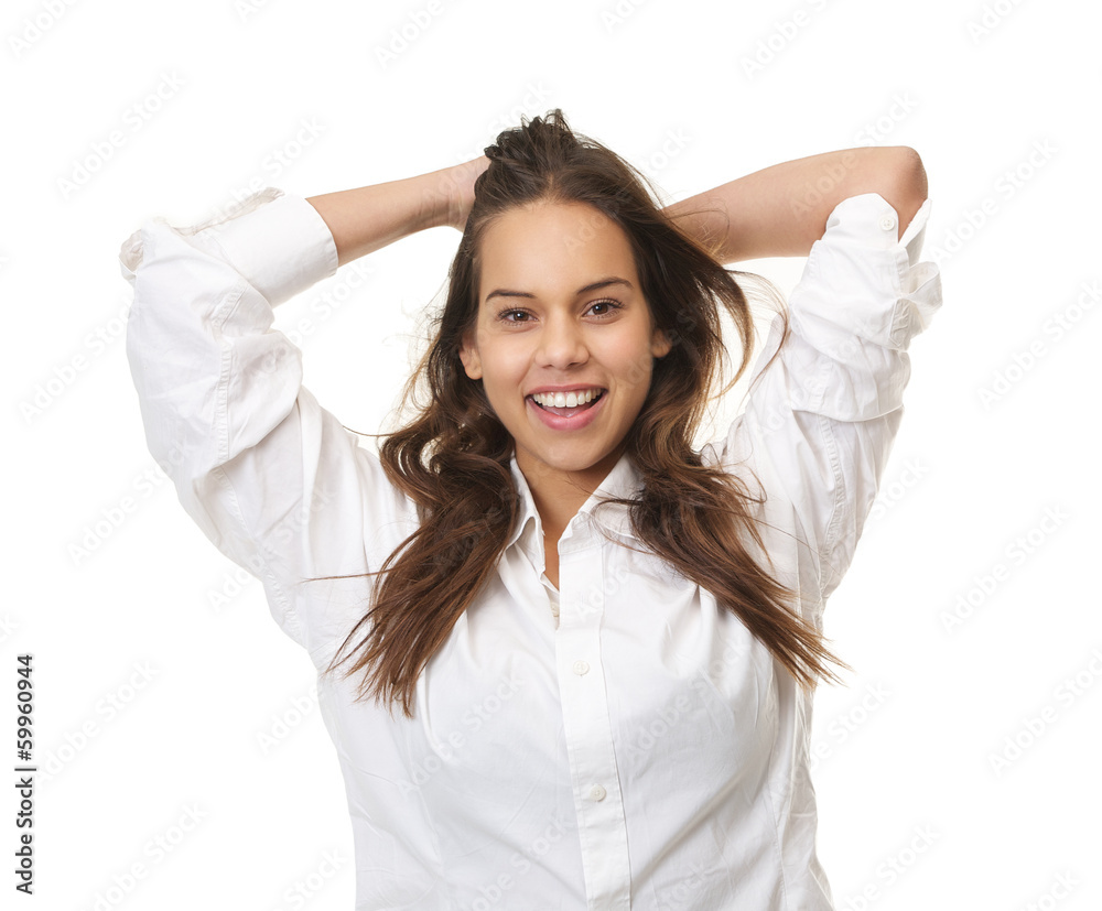Happy woman laughing with hands in hair Happy woman laughing with hands in hair