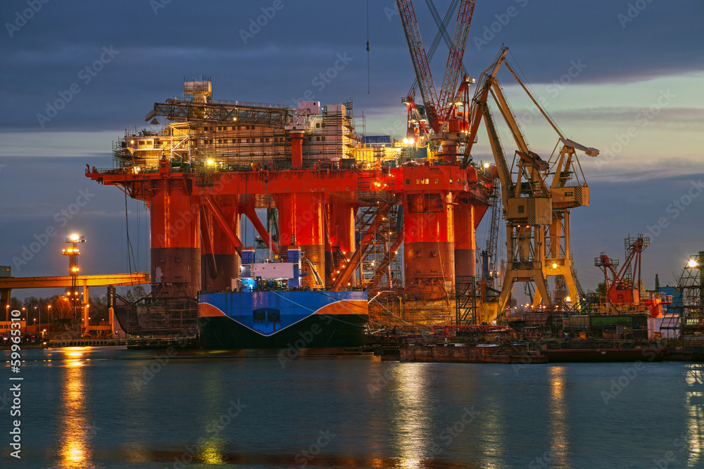 Oil rig at dawn in the shipyard of Gdansk, Poland.