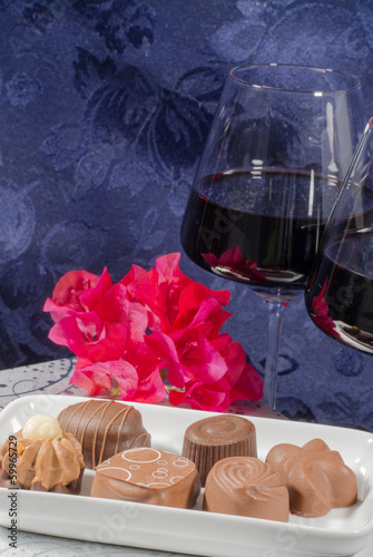 chocolate flowers red wine glasses