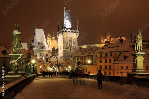 Night snowy Prague gothic Castle and St. Nicholas' Cathedral