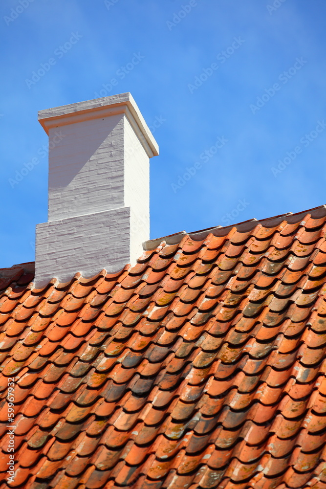 old tiles red roof with himney sky background old tiles red roof with himney sky background