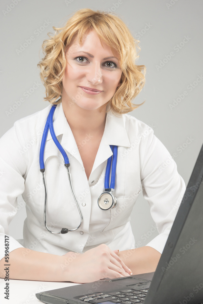 Professional Female Medic Staff with Laptop Professional Female Medic Staff with Laptop