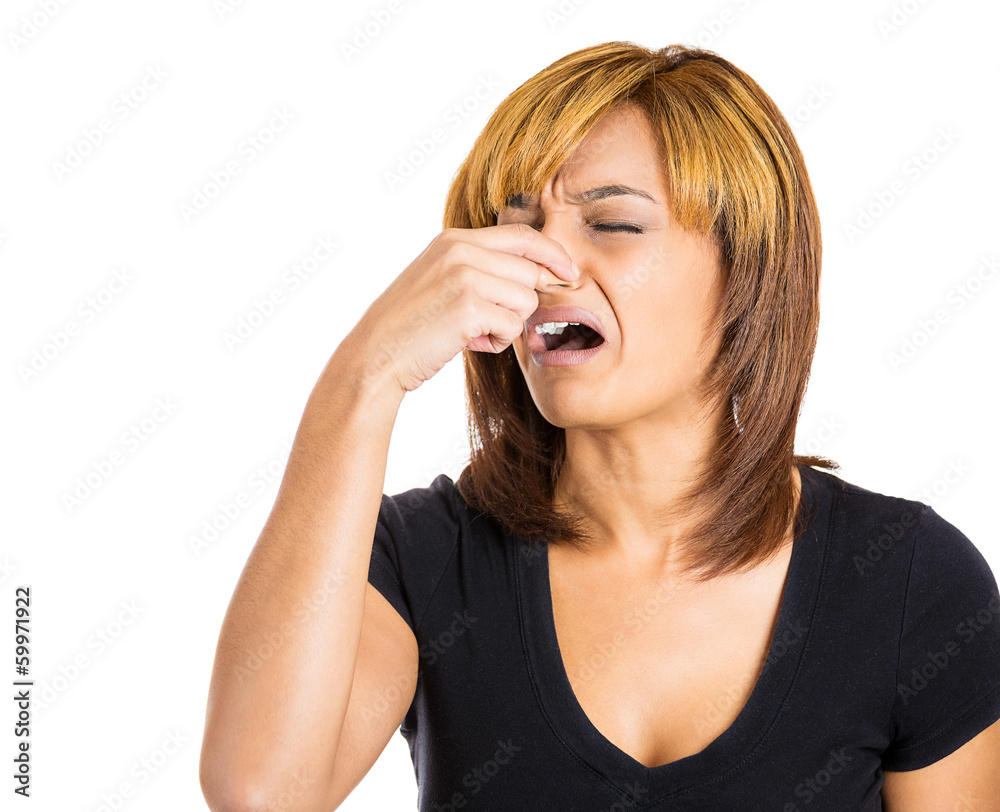 Woman pinches her nose, something stinks, very bad smell Woman pinches her nose, something stinks, very bad smell