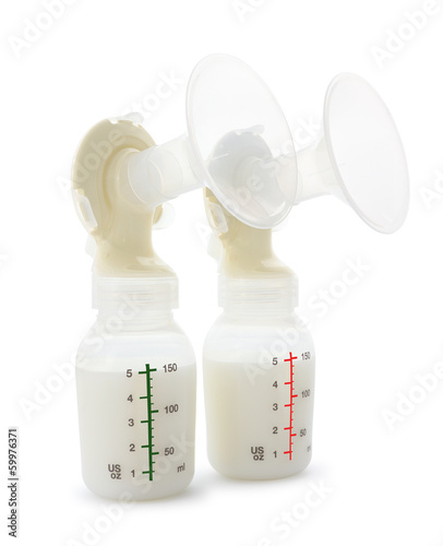Twin breast pump and milk bottles on white background.