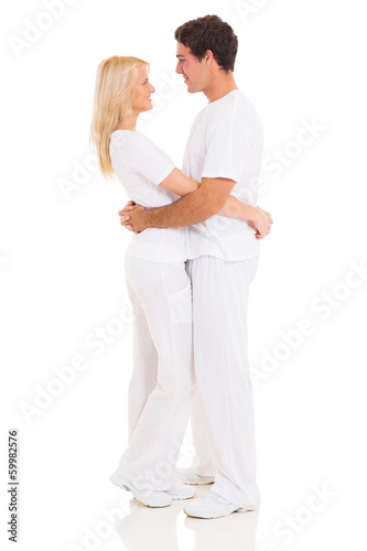 loving couple standing on white