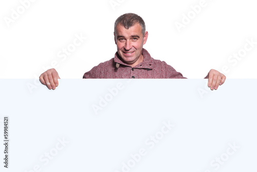 smiling casual old man holding a big blank board