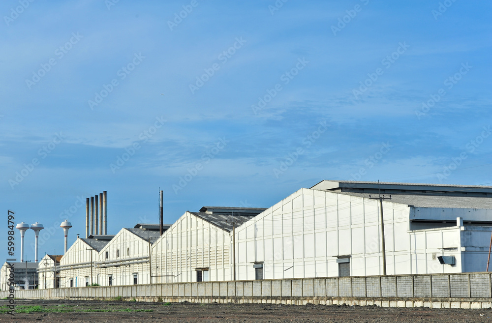 Fototapeta premium Warehouse building with blue sky
