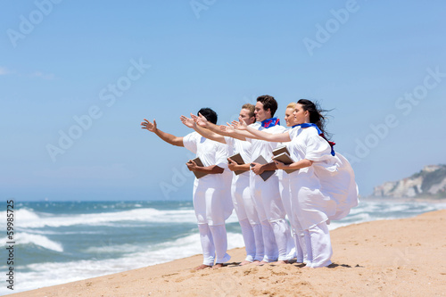 young church choir singing on the beach