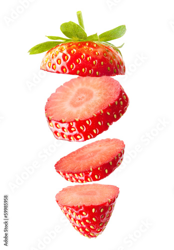 Falling strawberry isolated on white