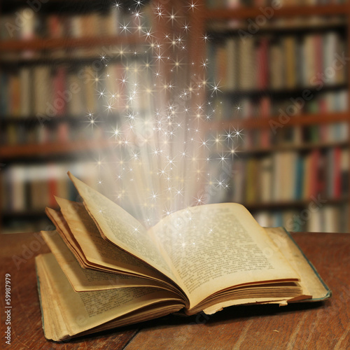 Obraz na płótnie Opened magic book with magic light w salonie