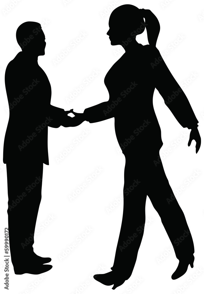 Handshake of business people standing up in silhouette
