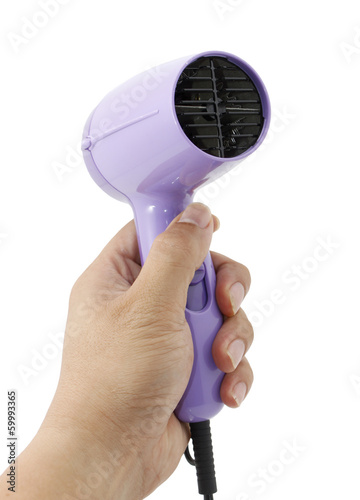 Hand holding hair dryer isolated on white