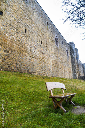 wodden bench near castle photo